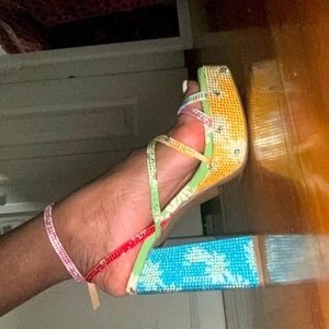 These stunning “Wild Pair” heels are a size 5!